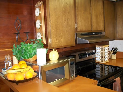 Very well stocked kitchen with new stainless steel appliances.