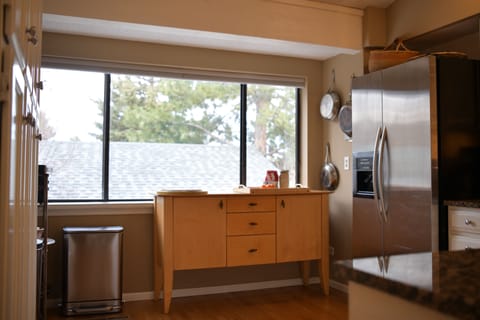 Views from kitchen. Tableware for 12. Bosch dishwasher, powerful fan.
