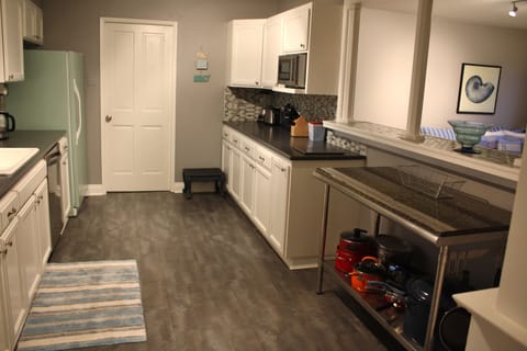 Kitchen view from other end, bar & great room on right.  Tons of counter space!