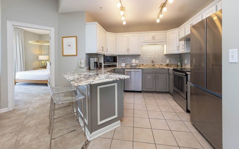 Cook and gather in this inviting kitchen featuring granite countertops, sleek appliances, and stylish bar seating