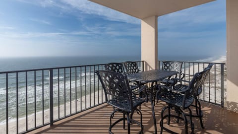 Savor meals or drinks at the outdoor patio set while enjoying expansive views of the waves from the top floor