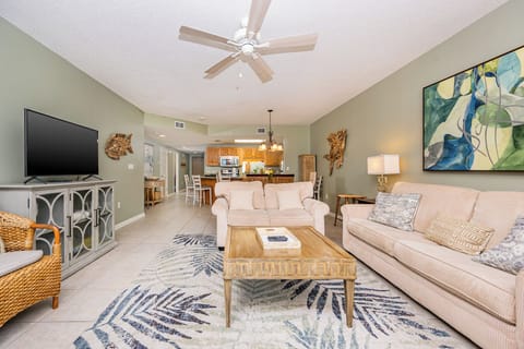 Relax on the comfortable sofas in the living area, surrounded by coastal decor and a welcoming atmosphere