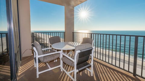 Savor your morning coffee at the round table, enjoying panoramic views and the warm sun on the spacious balcony