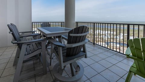 This balcony features comfortable seating and a stunning view of the state park from the twenty-second floor