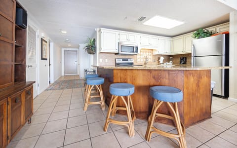 Stylish bar stools at the kitchen breakfast bar, perfect for casual meals or coffee and socializing