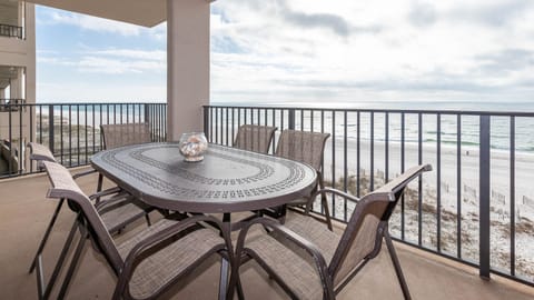 Savor meals at the outdoor table while enjoying views of the waves and the gentle breeze from the water