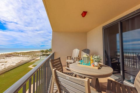 Sip your favorite drink at the outdoor table, surrounded by comfortable seating and a view of the tranquil shoreline