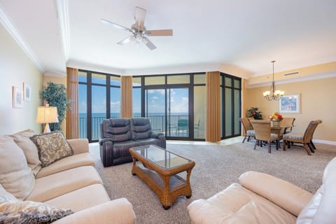 Feel the warmth of the sun while you enjoy a movie night in this inviting living room, surrounded by family