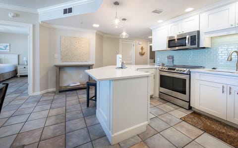 Prepare meals in the spacious kitchen with sleek countertops and stainless appliances, perfect for culinary adventures
