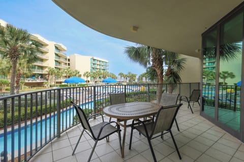 Relax on the balcony, soaking in the coastal breeze while enjoying the tranquil views of the pool