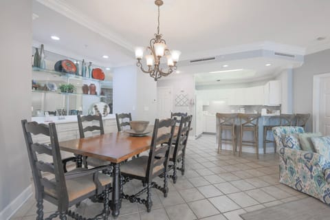 Gather around the dining table, savoring shared moments and laughter while enjoying the inviting vibe