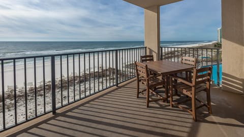 Dine al fresco at the outdoor table, enjoying refreshing breezes and views of the tranquil waters and shoreline