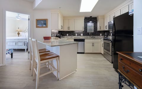 Enjoy cooking in the stylish kitchen with stainless and black appliances and a convenient breakfast bar