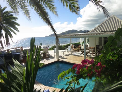Shell Villa is right on the edge of the ocean surrounded by mature gardens
