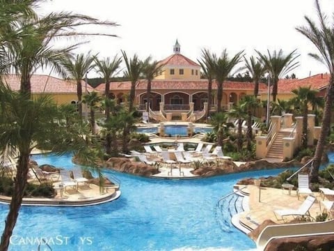 View of clubhouse, lazy river and water slide, heated year round,open until 11pm
