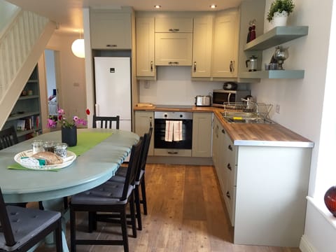 Kitchen and Dining room - cooker, dishwasher, microwave, toaster, kettle, more.