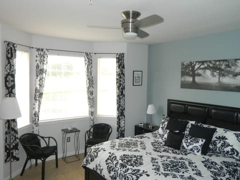 Master bedroom with  seating and remote control fan