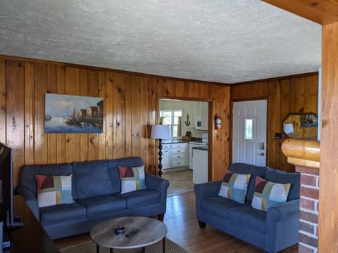 Living room includes couch, love seat, TV