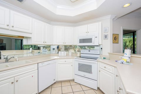 Experience seamless meal prep in this kitchen, where ample counter space invites culinary creativity