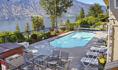 Welcome to Willow Point Retreat equipped with a stunning pool area with panoramic views of Lake Chelan and surrounding mountains creates the perfect scenic retreat.