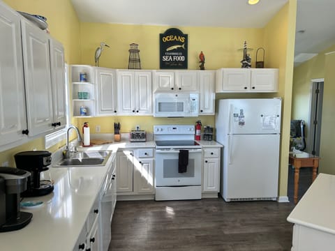 Open kitchen with new quartz countertops.