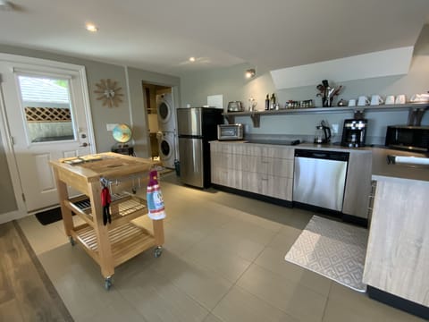 Large Kitchen area with Island & Washer & Dryer in utility room