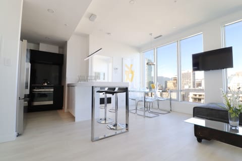 Open-concept living space with floor-to-ceiling and wall-to-wall windows