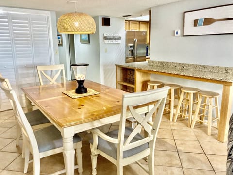 Dining for 6 (or more with bench) at the dining room table and 4 at the bar area!