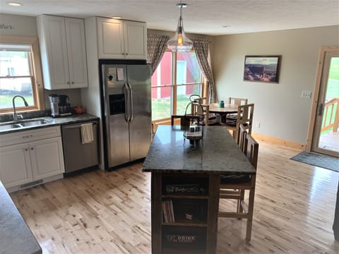 Cozy open concept kitchen, dining and living room 