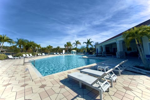 Modern pool deck with plenty of loungers available
