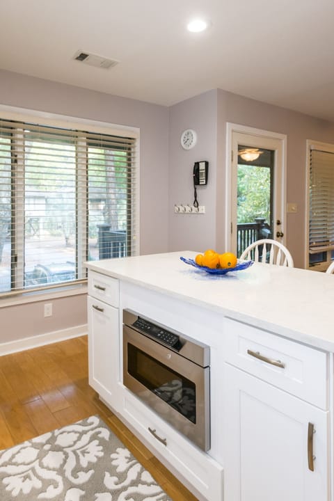 Island with Microwave.  Pull out garbage and recycling drawer on left .