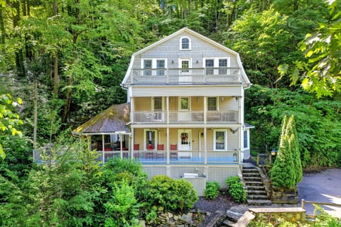 Welcome to Laughing Waters Lodge—a historic Montreat home with three decks and an expansive front porch, and creekside views!