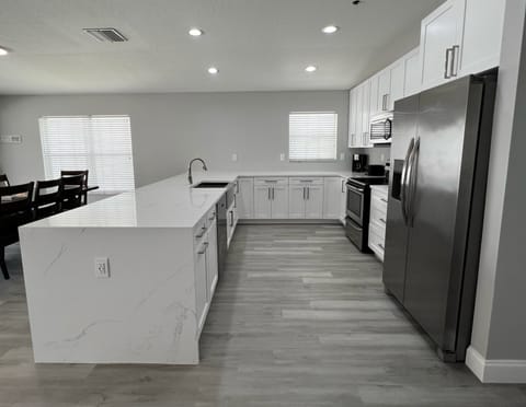 Beautifully updated kitchen with stainless steel appliances and - Beautifully updated kitchen with stainless steel appliances and plenty of prep space for your whole crew.