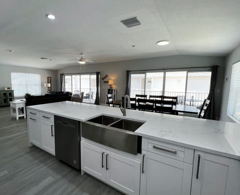 Another view of the gorgeously remodeled kitchen looking into th - Another view of the gorgeously remodeled kitchen looking into the dining area and living room.