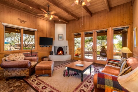 Experience the epitome of comfort and class in the cabin's living area, graced by a fireplace and a charming patio. Where relaxation meets sophistication. 🔥🏡🌳 #ElegantEscape