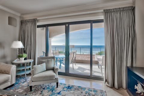 Villa Coyaba 107 view from the living area - Sliding glass doors to the patio overlooking the gulf. Enjoy easy access to the beach walkover and the large pool (heated November to mid-April)