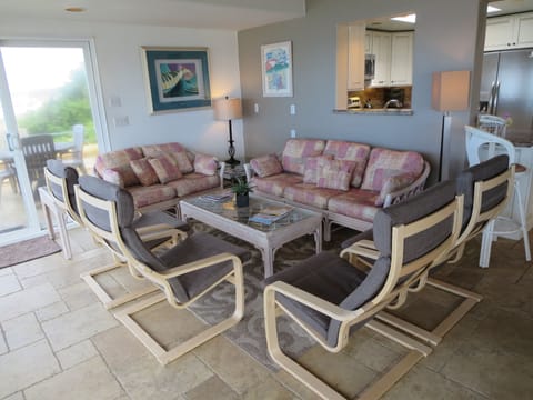 Very comfortable chairs that guests turn toward windows to watch ocean activity