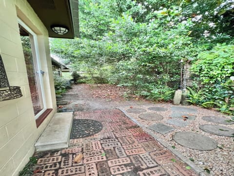 Shady & breezy fenced dog area with outdoor shower.  Gates at both ends.