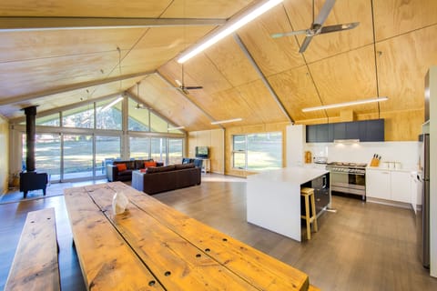 The great room with a cook's kitchen and 3.7 metre locally made dining table