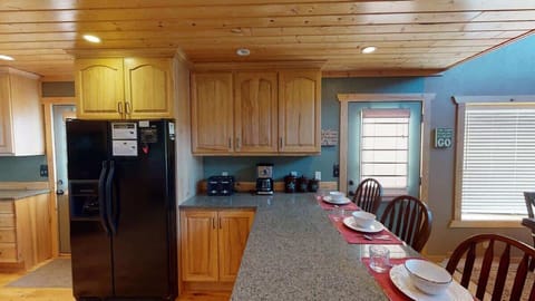 Full size kitchen with appliances, cookware, dishes, utensils, and basic cooking essentials.