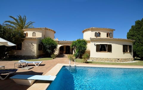 Front view of the house from the pool, a lot of space to relax