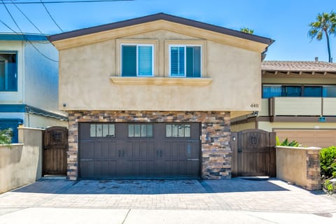 Driveway fits 3 cars plus 1 car in garage... ample parking! Privacy gates!