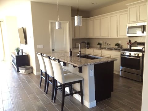 Granite Counters, Gas Range & Stainless Steele Appliances, Walk In Pantry