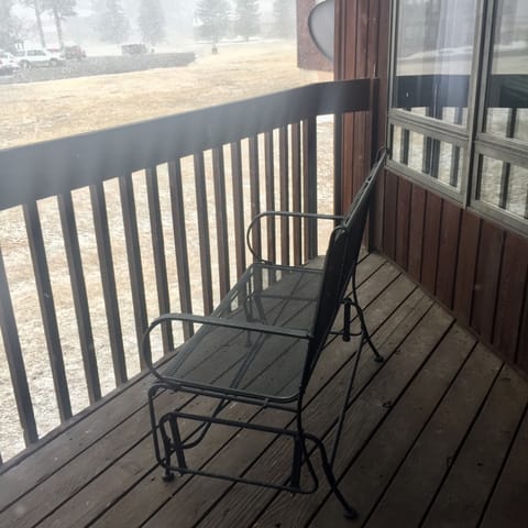 Double glider on the back patio to enjoy the mountains. 