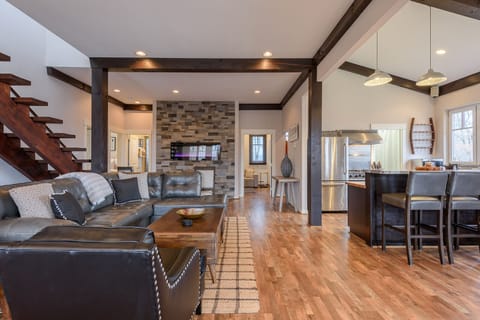 Living Area with Contemporary Leather Furniture, High Ceilings with Exposed Beams