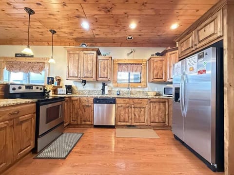 Equipped with dishes, silverware, pots and pans, and basic cooking essentials.