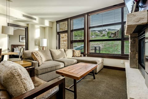 Relax and enjoy the amazing views from this light filled living room with floor to ceiling windows.