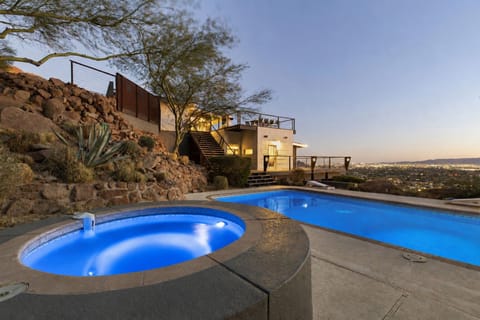 Spa, pool & city views, desert luxury after dark.