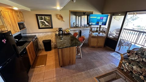 Granite topped island provides ample cooking prep space.