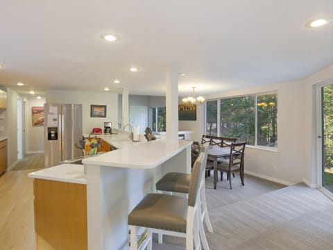Kitchen bar is great for kids and spacious sunken dining room that seats 8 guests.